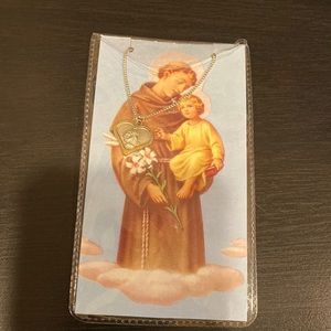 St. Anthony heart-shaped silver-toned pendant necklace. NWOT.